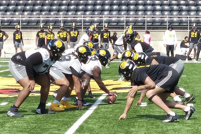 UAPB players line up to run a play during spring practice Wednesday at Simmons Bank Field in Pine Bluff. (Pine Bluff Commercial/Tanner Spearman)
