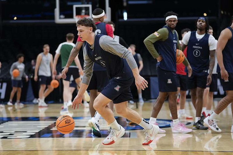 Arizona guard Pelle Larsson (3) dribbles during practice ahead of their Sweet Sixteen college basketball game in the NCAA tournament Wednesday, March 27, 2024, in Los Angeles. Arizona plays Clemson Thursday. (AP Photo/Ashley Landis)