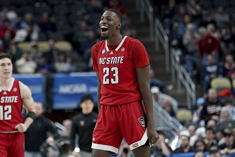 North Carolina State's Mohamed Diarra (23) celebrates after dunking against Texas Tech during the second half of a college basketball game in the first round of the men's NCAA Tournament, Thursday, March 21, 2024, in Pittsburgh. (AP Photo/Matt Freed)