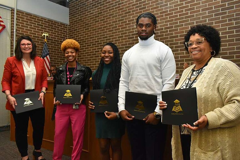 Pine Bluff High School students and career coaches were honored with Showing Your Stripes awards from district Superintendent Jennifer Barbaree (far left) after attending the Be Pro Be Proud Draft Day earlier this month in town. Also pictured: career coach Denesha Evans, senior Makiya Williams, senior Keaton Daniels and career coach Michelle Heard. (Pine Bluff Commercial/I.C. Murrell)
