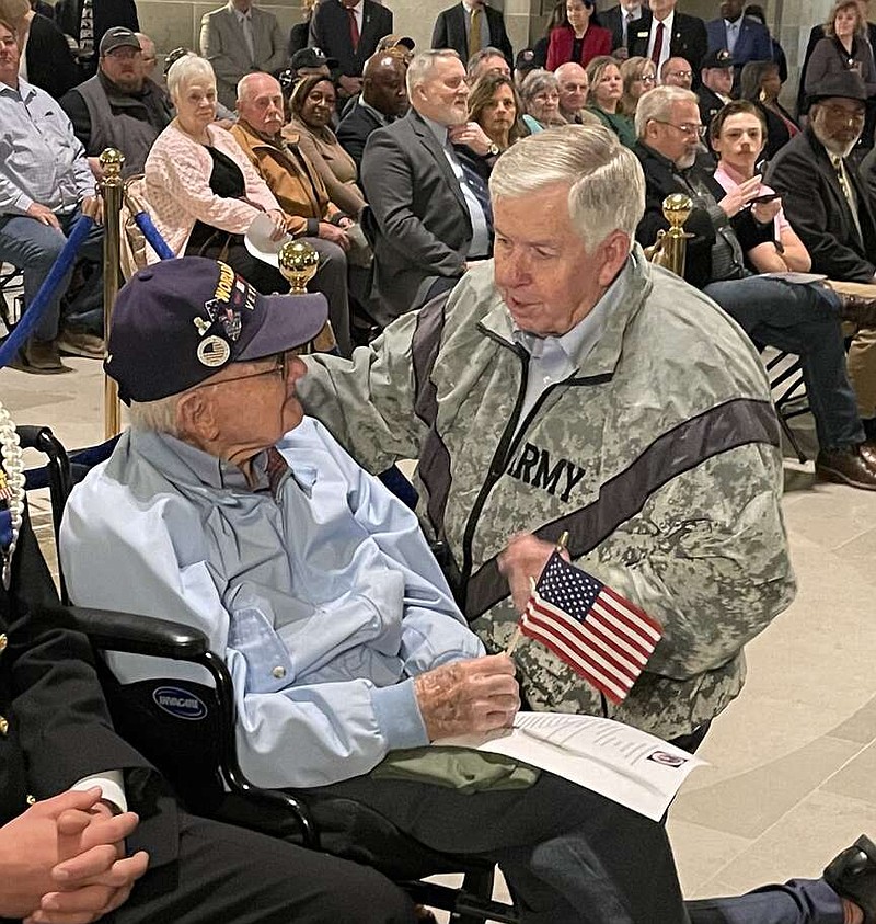 Kaden Quinn/News Tribune
Gov. Mike Parson visits with 103-year-old World War II veteran Othmar “Ott” Jasper before the Missouri House veterans recognition day begins.