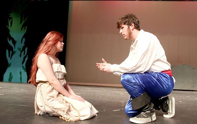 Eric the prince, played by junior Blake Jones, meets Ariel, played by Emily Draper, in this scene from the Disney Broadway musical, "The Little Mermaid."