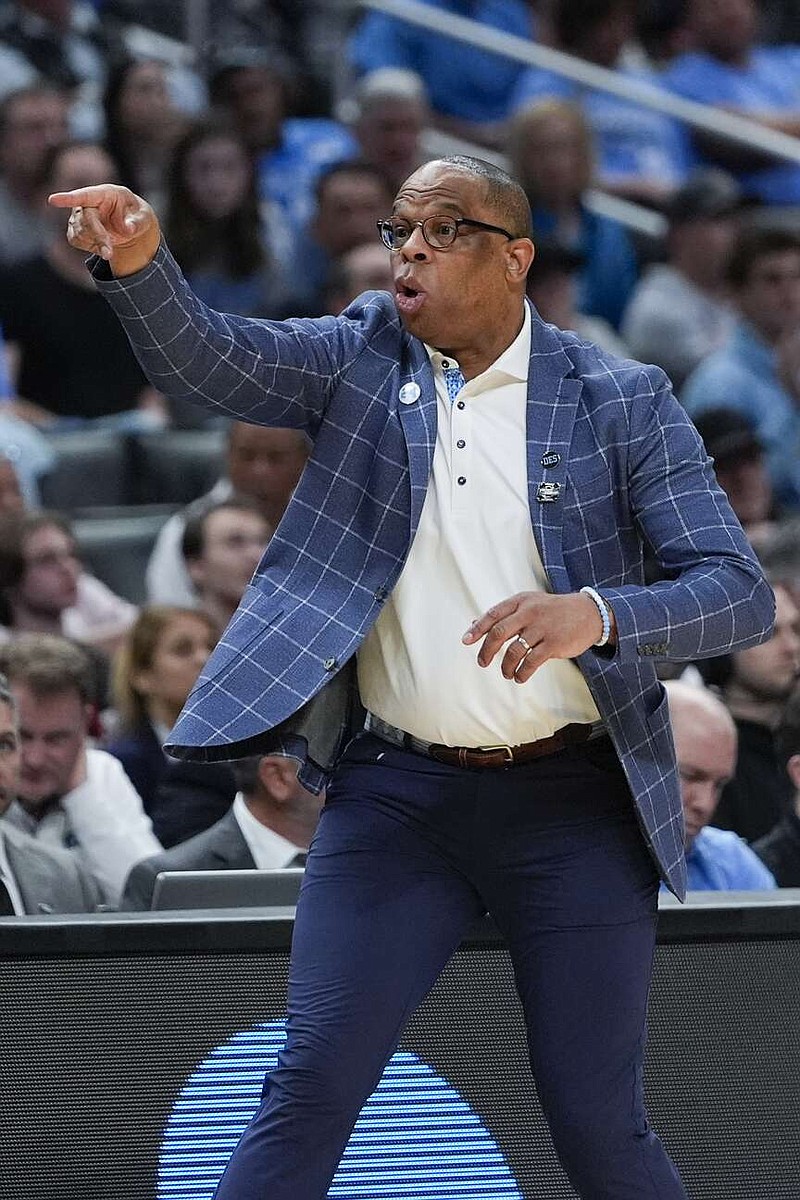 North Carolina head coach Hubert Davis gestures from the bench during the second half of a Sweet 16 college basketball game against Alabama in the NCAA tournament Thursday, March 28, 2024, in Los Angeles. (AP Photo/Ryan Sun)