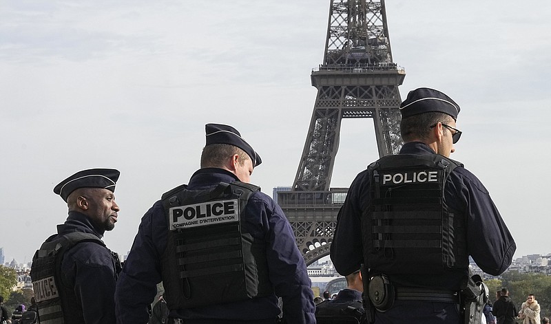 FILE - Police officers patrol the Trocadero plaza near the Eiffel Tower in Paris, Tuesday, Oct. 17, 2023. France says it has asked 46 countries if they can supply more than 2,000 police officers to help secure the Paris Olympics. Organizers are finalizing security planning for the July 26-Aug. 11 Games, the French capital&#x2019;s first in a century. (AP Photo/Michel Euler, File)