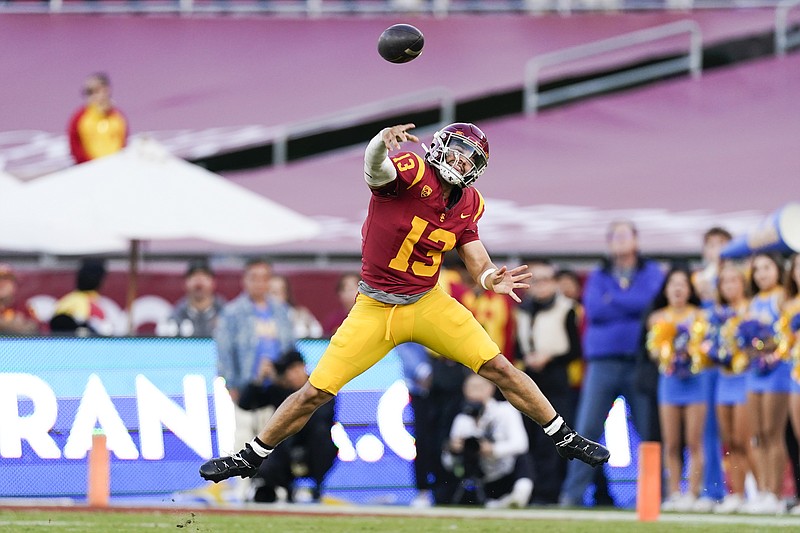 FILE - Southern California quarterback Caleb Williams throws a pass during the second half of the team's NCAA college football game against UCLA, Saturday, Nov. 18, 2023, in Los Angeles. The Chicago Bears passed up C.J. Stroud and Bryce Young last year because they had Justin Fields. Now, they&#x2019;ve got a shot at Caleb Williams.(AP Photo/Ryan Sun, File)
