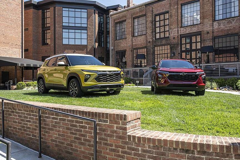 View of 2024 Chevrolet Trax RS in Crimson Red Metallic and 2024 Chevrolet Trailblazer LT in in Nitro Yellow Metallic staged in front of the Foundry Hotel Asheville. (Photo courtesy of Chevrolet)