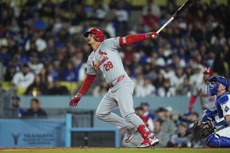 St. Louis Cardinals' Nolan Arenado watches after hitting a sacrifice fly during the eighth inning of Friday's game against the Los Angeles Dodgers in Los Angeles. (AP Photo/Jae C. Hong)
