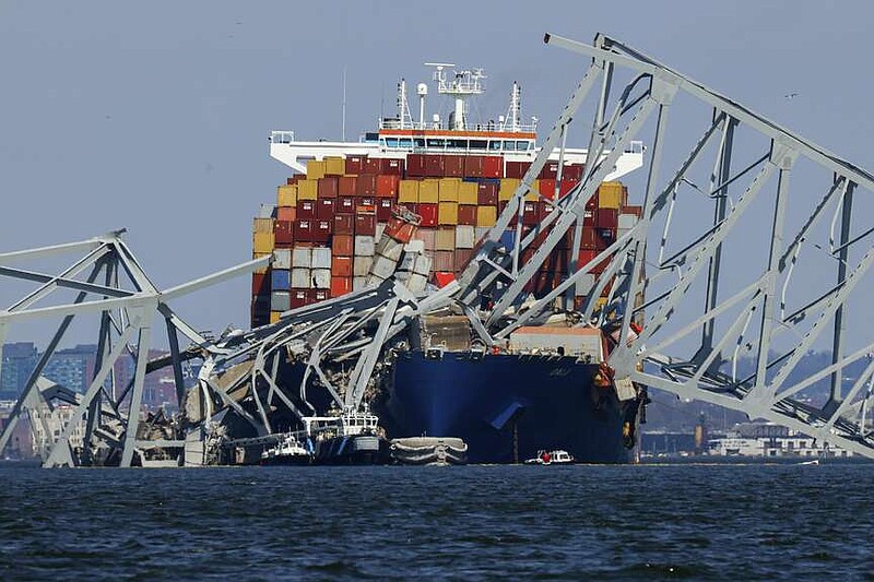 Wreckage of the Francis Scott Key Bridge rests on the container ship Dali, Saturday, March 30, 2024, in Baltimore, Md. (AP Photo/Julia Nikhinson)