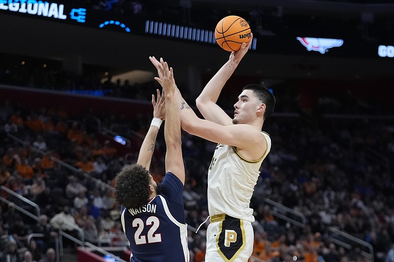 Purdue center Zach Edey shoots over the defense of Gonzaga forward Anton Watson (22) during the second half of a Sweet 16 college basketball game in the NCAA Tournament, Friday, March 29, 2024, in Detroit. (AP Photo/Paul Sancya)