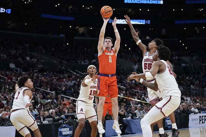 Clemson guard Joseph Girard III (11) shoots against Alabama during the first half of an Elite 8 college basketball game in the NCAA tournament Saturday, March 30, 2024, in Los Angeles. (AP Photo/Ashley Landis)
