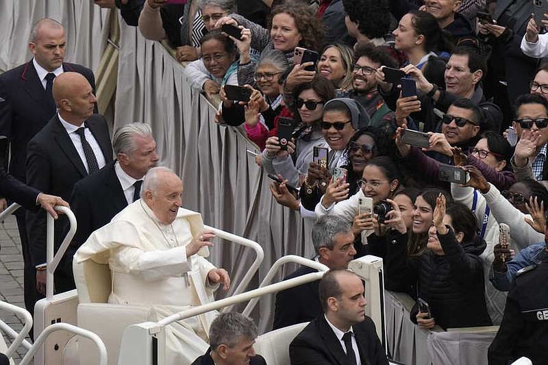 Pope Francis waves faithful after celebrating Easter mass in St. Peter's Square at the Vatican, Sunday, March 31, 2024. (AP Photo/Alessandra Tarantino)
