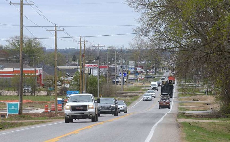 Motorists travel Tuesday along Arkansas 102 in Centerton near Arkansas 279, also called Vaughn Road. A roundabout is scheduled to be built at the intersection.
(NWA Democrat-Gazette/Flip Putthoff)