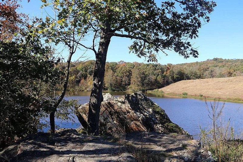 The views along Lincoln Lake include rock bluffs, trees and the dam in background on the right. The city of Lincoln and NWA Land Trust have entered into a conservation agreement to protect recreation and the natural assets of the lake and surrounding property.
(File Photo/NWA Democrat-Gazette)