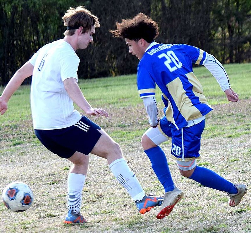 Mike Eckels/Special to the Eagle Observer
After stealing the ball away from a Husky midfielder, Bulldog Ricky Thor starts a drive downfield toward the opposing net during the first half of the Decatur-Haas Hall-Bentonville boys' soccer match on March 25.