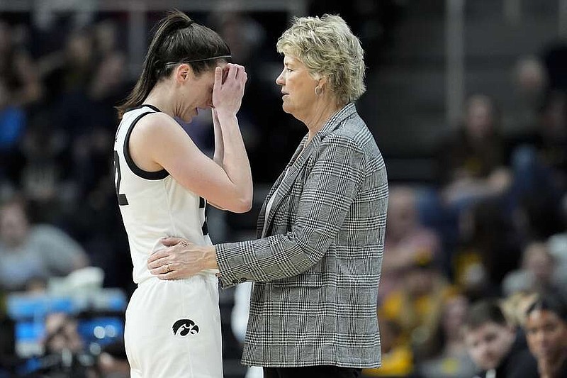 Iowa guard Caitlin Clark (22) talks with head coach Lisa Bluder during the fourth quarter of Iowa's game against Colorado during the NCAA Tournament, Saturday, in Albany, N.Y. (AP Photo/Mary Altaffer)