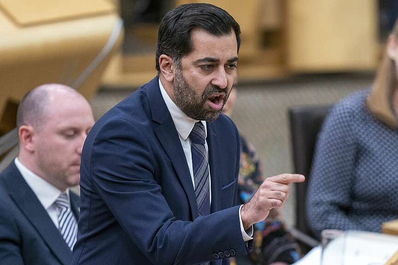 Scotland's First Minister Humza Yousaf speaks during First Minster's Questions (FMQ's) at the Scottish Parliament in Holyrood, Edinburgh, Scotland, Thursday March 28, 2024. (Jane Barlow/PA via AP)