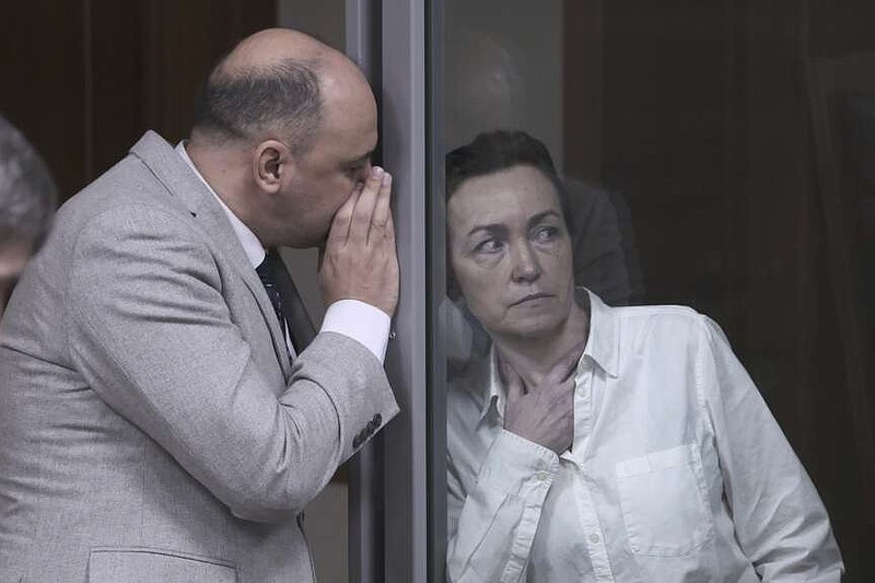 Alsu Kurmasheva, an editor for the U.S. government-funded Radio Free Europe/Radio Liberty's Tatar-Bashkir service, listens to her lawyer during a court hearing in Kazan, Russia on Monday, April 1, 2024. The court on Monday extended pre-trial detention of Kurmasheva, who holds U.S. and Russian citizenship, and was accused of failing to register as a foreign agent and spreading "false information" about the Russian military in a case widely seen as part of the Kremlin's unrelenting crackdown on dissent and free speech. (AP Photo)
