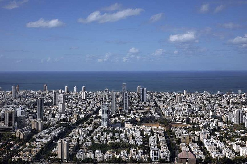 FILE - A general view shows the center of Tel Aviv, Israel, Thursday, Dec. 2, 2021. Prime Minister Benjamin Netanyahu has vowed to shut down Al Jazeera's operations in Israel, calling it a “terror channel” that spreads incitement, after parliament passed a law clearing the way for the closure. (AP Photo/Oded Balilty, File)
