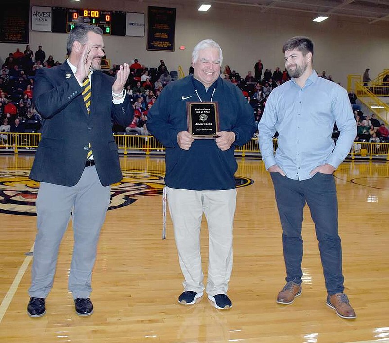 Mark Humphrey/Enterprise-Leader

Colorado Rockies pitcher Jalen Beeks (right) was inducted into the Prairie Grove Hall of Pride during a ceremony held between the girls and boys basketball games against Farmington on Friday, Jan. 19, 2024. Presenting the plaque were Prairie Grove High School Principal Jed Davis (left) and athletic director Dave Torres. Beeks graduated from Prairie Grove in the spring of 2011, attended Crowley College on a baseball scholarship before transferring to the Arkansas Razorbacks. He was drafted in the 12th round of the 2014 Major League baseball draft by the Boston Red Sox. A trade sent Beeks to the Tampa Bay Rays in 2018. He recently signed with the Rockies.