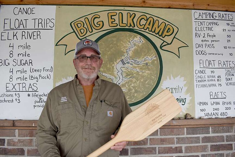 Rachel Dickerson/McDonald County Press
Pat Tinsley of Big Elk Floats and Camping in Pineville is pictured with an engraved paddle he received after the business was recently named Outfitter of the Year for 2024 by the Missouri Canoe and Floaters Association.