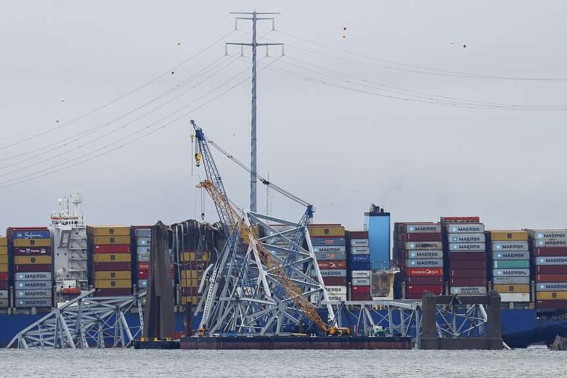 Salvage work continues on the collapsed Francis Scott Key Bridge, Tuesday, April 2, 2024, in Baltimore. (AP Photo/Julia Nikhinson)