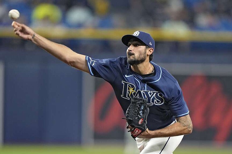 Tampa Bay Rays starting pitcher Zach Eflin delivers to a Texas Rangers batter during the first inning of a baseball game Tuesday, April 2, 2024, in St. Petersburg, Fla. (AP Photo/Chris O'Meara)