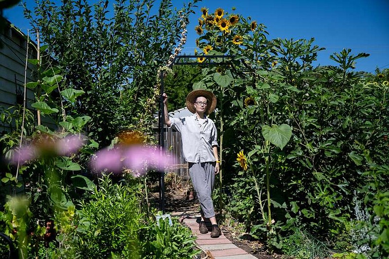 Charis Hill transformed this backyard into an oasis of plants, trees and herbs despite chronic health conditions that cause pain, fatigue and issues with mobility. MUST CREDIT: Photo for The Washington Post by Marlena Sloss�
