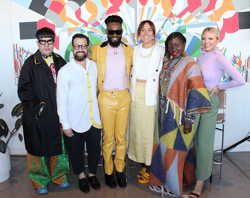 Robin Atkinson, Interform CEO (third from right) is joined by designers and "Project Runway" alumni Mondo Guerra (from left), Victor Luna, Prajje Oscar, Korto Momolu and Brittany Allen at a reception for Northwest Arkansas Fashion Week sponsors March 27 at Ledger in Bentonville.
(NWA Democrat-Gazette/Carin Schoppmeyer)
