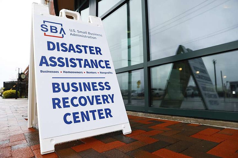 A sign for a Small Business Administration business recover center following the collapse of the Francis Scott Key Bridge, Tuesday, April 2, 2024, in Baltimore. (AP Photo/Julia Nikhinson)