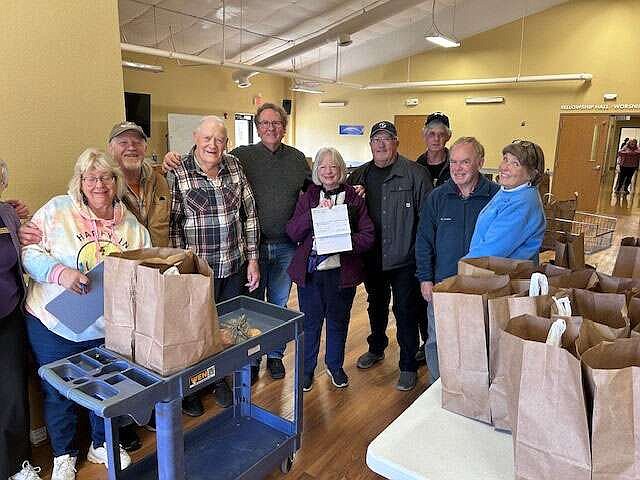 Submitted photo
The Oasis Food Pantry at Village Bible Church recently received a $1,000 donation from the Bella Vista Community Church Outreach Project.