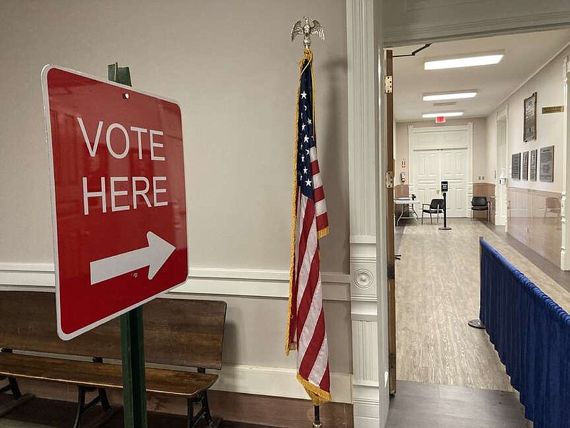 The arrow points the way to the voting machines. (Pine Bluff Commercial/Byron Tate)