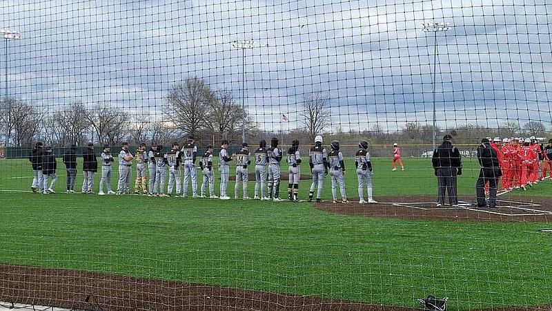 Fulton stands across the third base and Mexico the first base line during the national anthem on Thursday at Mexico High School in Mexico, Missouri. (Fulton Activities/Courtesy)