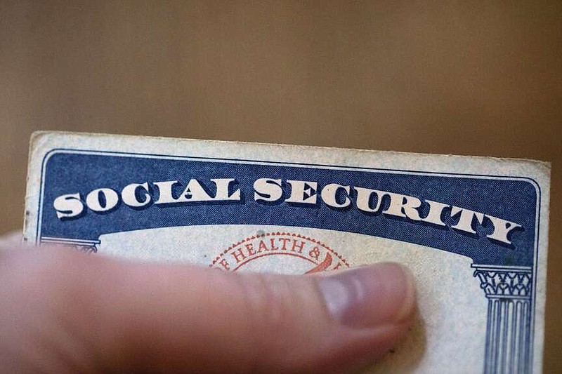 FILE - A Social Security card is displayed on Oct. 12, 2021, in Tigard, Ore. Only about 1 in 8 adults know when they'll be eligible for full retirement benefits through Social Security, according to a 2023 survey from the Nationwide Retirement Institute. (AP Photo/Jenny Kane, File)