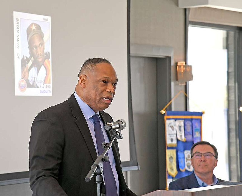Alliance Rubber Purchasing and Contract Director Bryan Smith speaks at a Hot Springs National Park Rotary Club meeting while an image of his Houston Astros baseball card is displayed on a screen behind him at the DoubleTree by Hilton Hot Springs. (The Sentinel-Record/Lance Brownfield)