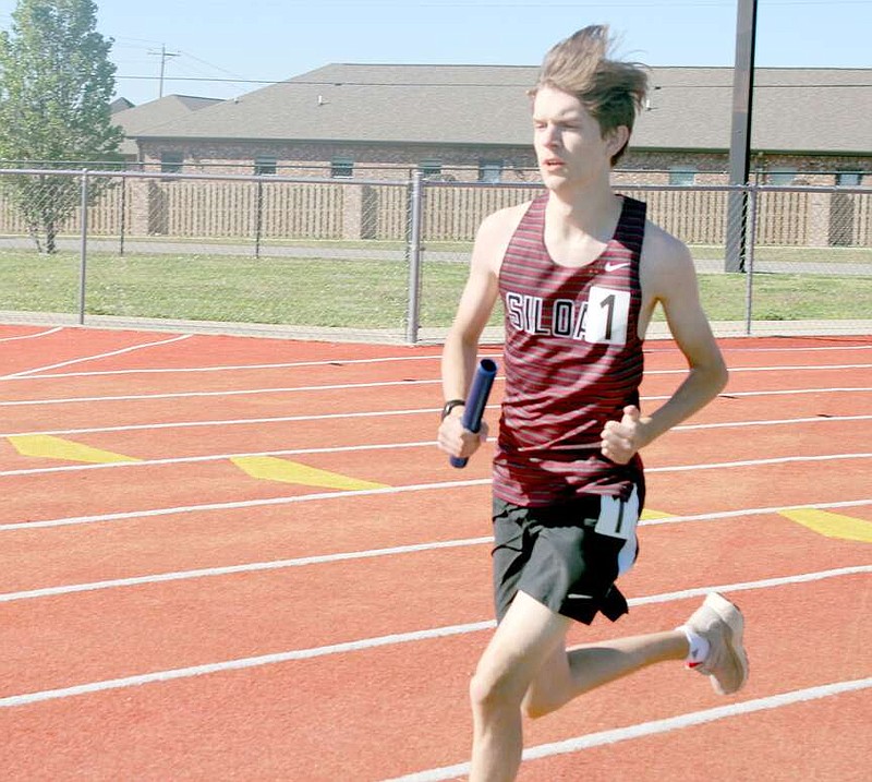 Photograph courtesy of Annette Beard/Pea Ridge Times
Senior Elliot Jones of Siloam Springs compete in a relay race at the Blackhawk Relays in Pea Ridge on April 4.