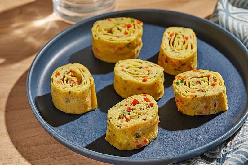 Rolled omelet, called gyeran mari in Korean and tamagoyaki in Japanese, is a popular side dish in both cuisines, often added to bento boxes, served on bowls of ramen or presented among all the other delectable little plates alongside the main course or courses. (For The Washington Post/Tom McCorkle)