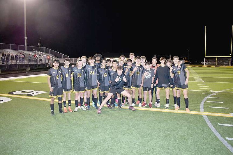 Mark Humphrey/Enterprise-Leader

Prairie Grove boys soccer team celebrates the program's first win on its newly-installed artificial turf playing surface at Tiger Den Stadium with a 2-0 defeat of Gentry on Friday in 4A West Conference action. Gentry lined up for a free kick from the Prairie Grove 11-yard line with the clock stopped with 17 seconds left in the second half, but the Tigers blocked the kick and shut the Pioneers out, winning 2-0 on a first half goal by Charlie Nunn and a second half goal by Levi Reed.