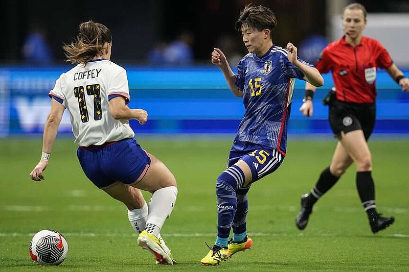 United States' Sam Coffey (17) and Japan's Aoba Fujino (15) battle for the ball in the first half of the SheBelieves Cup women's soccer tournament, Saturday, April 6, 2024, in Atlanta. (AP Photo/Mike Stewart)