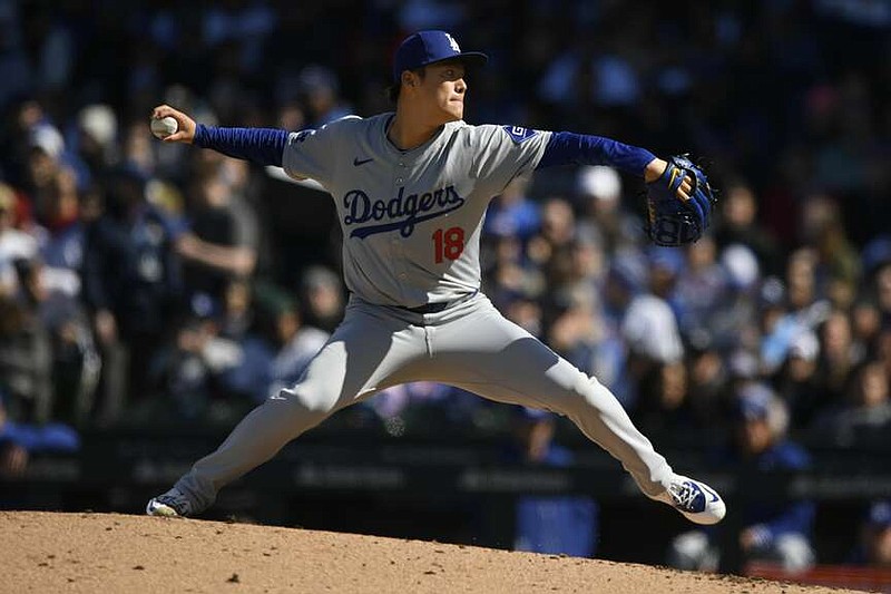 Los Angeles Dodgers starter Yoshinobu Yamamoto delivers a pitch during the first inning of an baseball game against the Chicago Cubs, Saturday, April 6, 2024, in Chicago. (AP Photo/Paul Beaty)