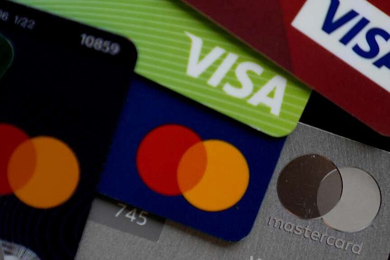 Adding your child as an authorized user on your credit card can be a simple way to start building their credit file. But if the issuer doesn't report account details to the credit bureaus or your account isn't in good standing, their credit score won't get enhanced.  (AP Photo/Nam Y. Huh, File)