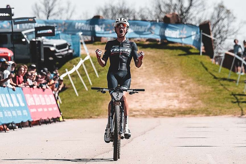 American Riley Amos celebrates as he crosses the line to win Saturday's cross country race at the U.S. Pro Cup at Centennial Park in Fayetteville. 
(Special to NWA Democrat-Gazette/Kai Caddy)