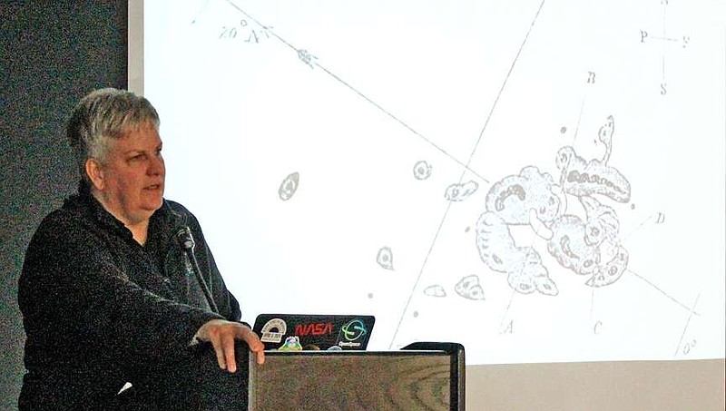 Earth to Sky Eclipse Coordinator Cris White discusses the Carrington Event, a massive solar storm that Richard Carrington observed in 1859 during a presentation at the Garland County Library Thursday. (The Sentinel-Record/James Leigh)