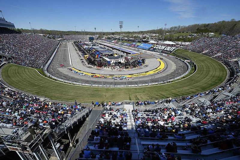 Drivers race around the track during a NASCAR Cup Series auto race at Martinsville Speedway in Martinsville, Va., Sunday, April 7, 2024. (AP Photo/Chuck Burton)