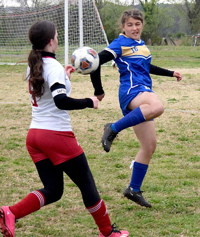 Mike Eckels/Special to the Eagle Observer
Lady Bulldog Larea Echeverria (16) uses a backkick to send the ball away from a Lady Highlander player during the Decatur-Eureka Springs girls' soccer match at Bulldog Stadium in Decatur on April 2. The Lady Bulldogs defeated the Lady Highlanders 4-1.