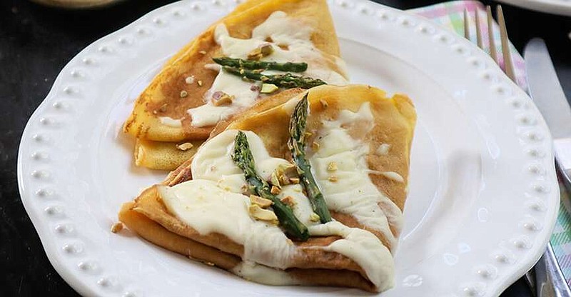 TNS
Pureed asparagus blended with fresh ricotta is a seasonal filling for these savory crepes.