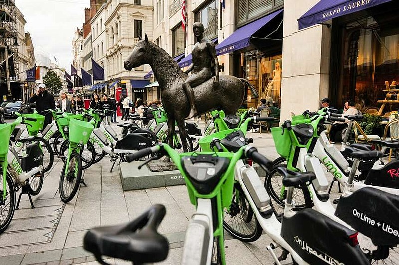 Electric hire bikes, operated by Lime Technologies AB, outside the Ralph Lauren Corp. store in central London, on Thursday, Oct. 19, 2023. MUST CREDIT: Jose Sarmento Matos/Bloomberg