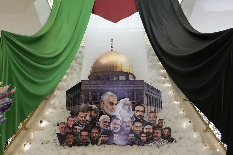 A display showing slain Iranian military officials and allied Lebanese and Palestinians next to the al-Aqsa Mosque is set up, as the Iranian embassy receives condolences for the death of Iranian Revolutionary Guard Gen. Mohammad Reza Zahedi, who led the Iranian Revolutionary Guard's Quds Force in Lebanon and Syria until 2016, and six other Iranian military officials, in Beirut, Lebanon, Monday, April 8, 2024. An Israeli airstrike that demolished Iran's consulate in Syria on last Monday killed two Iranian generals and five officers, according to Iranian officials. The strike appeared to signify an escalation of Israel's targeting of military officials from Iran, which supports militant groups fighting Israel in Gaza, and along its border with Lebanon. (AP Photo/Hassan Ammar)