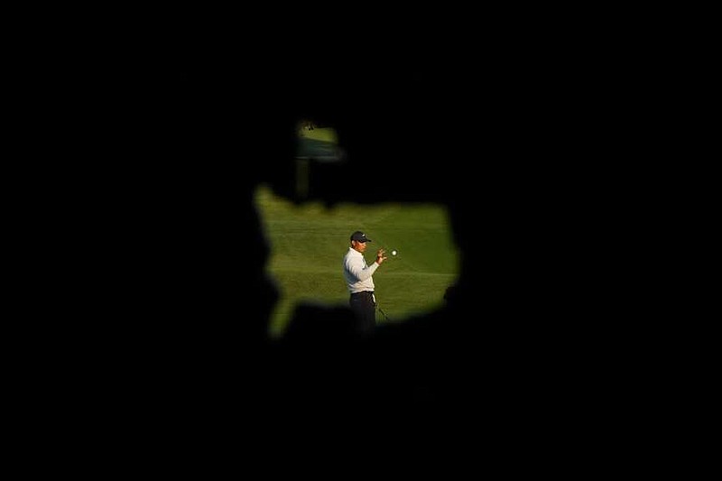 Tiger Woods warms up on the driving range during a practice round in preparation for the Masters golf tournament at Augusta National Golf Club Monday, April 8, 2024, in Augusta, Ga. (AP Photo/Matt Slocum)