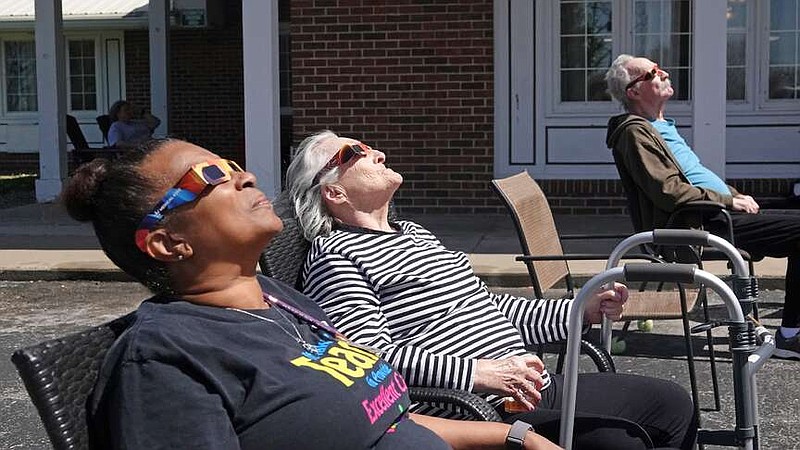 Annie Goldman/Fulton Sun
Novarra Jean Oliver and Glenda Blake look up at the sky from the parking lot of Fulton Manor Care Center on Monday, April 8, 2024 in Fulton, Mo. Oliver said residents enjoyed the event.