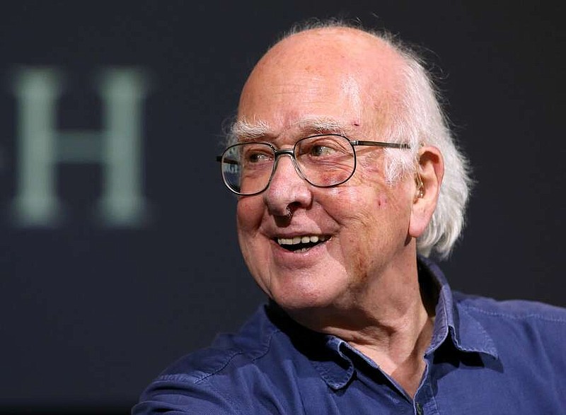 FILE - In this file photo dated Friday, Oct. 11, 2013, Britain's Professor Peter Higgs smiles during a press conference in Edinburgh, Scotland, Friday, Oct. 11, 2013.  A group of 13 Nobel laureates, including Peter Higgs, have written an open letter published in a British national newspaper Saturday June 11, 2016, urging U.K. referendum voters to remain inside the European Union, warning that Britain will lose funding, global influence and access to expertise if the nation votes to leave the 28-nation bloc.(AP Photo/Scott Heppell, FILE)